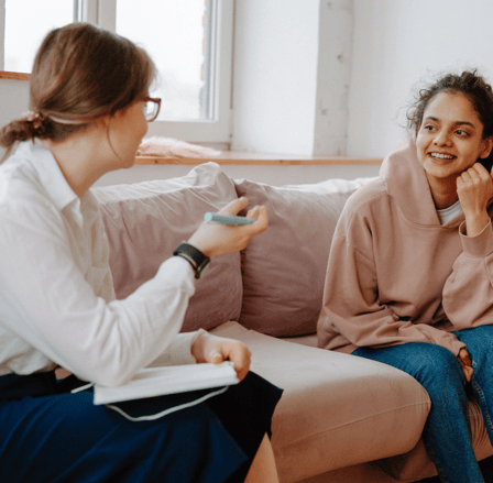 Therapy session, therapist, women talking, young person, help, support, listen, couch